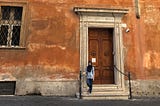 A picture of me standing outside the Pontifical Biblical Institute in Rome, Italy.