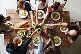 A group of people at dinner making a toast.