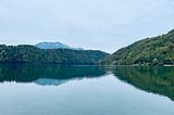 A photo of Lake Levico’s clear blue waters captured by the author
