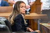 Photo of Karen Read sitting in court.