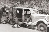 Bonnie and Clyde, dead in their vehicle after a police ambush.