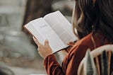 woman reading a book slow