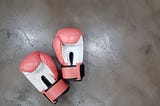Pair of pink boxing gloves