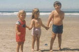 1986 — Nye Beach, Newport, Oregon with my three kids, Jeremy (age 2), Melissa (age 3), and Stevie (age 5) (Photo taken by author a long time ago)