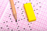Exam scantron card with a pencil and eraser