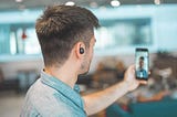 Man recording video with phone for virtual professional networking