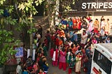 Parents standing outside a school.