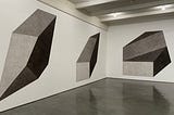 Sol LeWitt — Wall Drawing #411 B,D,E: Isometric figure with progressively darker gradations of gray ink wash on each plane, 2003