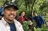 James Kwon in the forest with fellow staff.