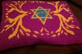 The embroidered tallit bag my mom made me for my bar mitzvah.