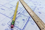 Blueprint with a ruler and pencil
