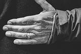 The hand of an elderly person.