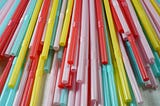 Colorful plastic straws — A pile of multicolored plastic straws.