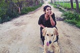 My pet golden retriever Alzu and I somewhere in the rice fields in Sri Ganganagar, Rajasthan on our road trip together