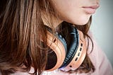 Teen with headphones around her neck