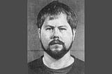 black & white mug shot of Todd Alan Reed