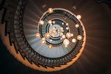 Spiral staircase with hanging light bulbs