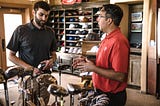 two males standing in a golf store