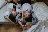 Couple sharing a bed.