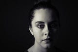 Sad woman with tear down her face