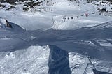 Steep ski run and chairlift.