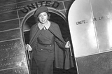Ellen Church, the first flight attendant, stands on a United Airlines plane in 1930. A registered nurse and licensed pilot, Church created the profession that year. Church’s legacy has a positive influence on aviation safety and passenger wellbeing to this day. (Photo courtesy of Association of Flight Attendants)