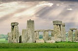 Rear view of Stonehenge, showing different heights of Sarsen stones, some with lintels.