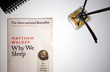 Why We Sleep book with some decorative reed diffuser