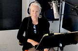 woman in a recording studio booth