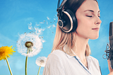 On a light blue background, bright yellow and white dandelions. One dandelion is dispersing its seeds to the right, directly into the headset of a young woman, closing her eyes, and holding a microphone.