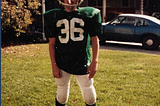 The author wearing a football uniform with the number 36