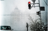A lone figure stands on a street corner in Yakutsk, Siberia