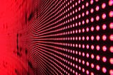 a pattern of red lights on black background