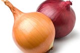 A pair of onions sitting together.