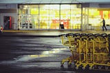 Yellow shopping carts outside a grocery store