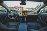 image of the interior of a tesla, a self-driven car