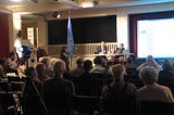 Public meeting with an audience.