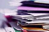 Stacks and piles of endless papers in office