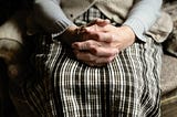 Elderly woman praying