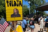 Photo of protester’s sign in Santa Fe plaza after the No Kings protest march. Sign is of Kamala Harris and the sign says, “Told ya”.