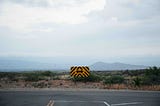 Two-sided arrow road sign