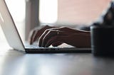 hands on a laptop keyboard. person acting to get into flow