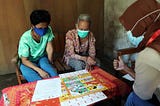 Ratna when delivering COVID-19 risk information and prevention education to an elderly participant who was accompanied by a family member