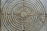 Image of Labyrinth on the portico of the cathedral of San Martino at Lucca, Tuscany, Italy.