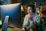 Happy woman at desktop computer