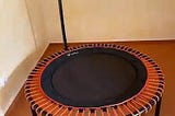 Bellicon trampoline with orange bungees