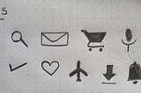 Common web and mobile icons — Back, search, email/message, shopping cart, microphone, compass, more, done/check, heart/like, flight mode, download, notification/bell icon