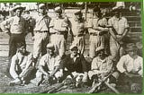 image of male baseball players. Photo appears to have been from the early 1900s.