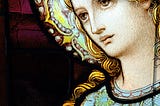 A close-up photo of a stained glass image of Mother Mary. photo by: Mark Strozier