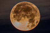 Image of a full moon against a night sky